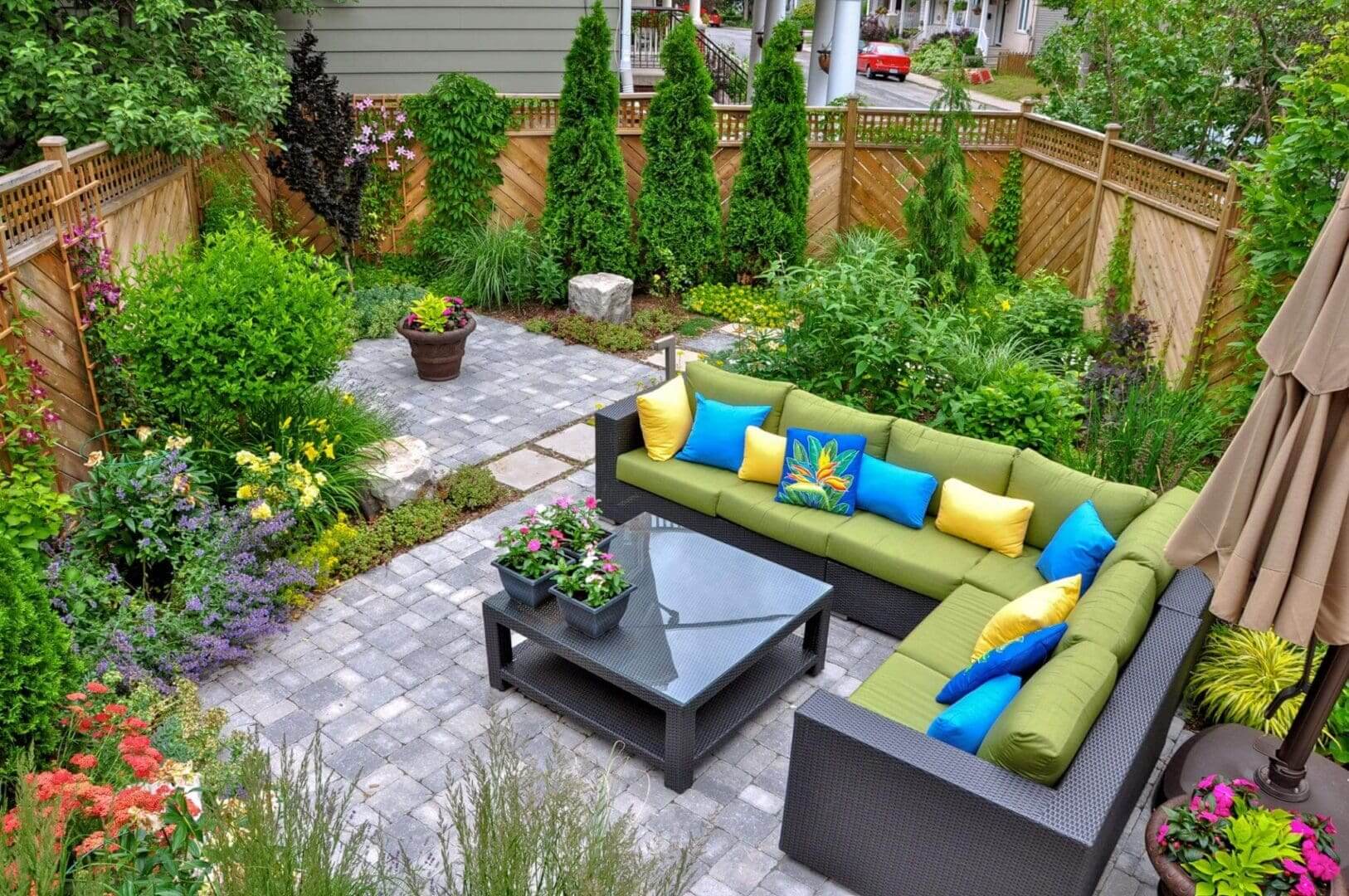 Colorful garden patio with sectional seating.